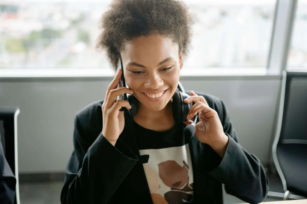 Customer service agent handling a callback request on headset
