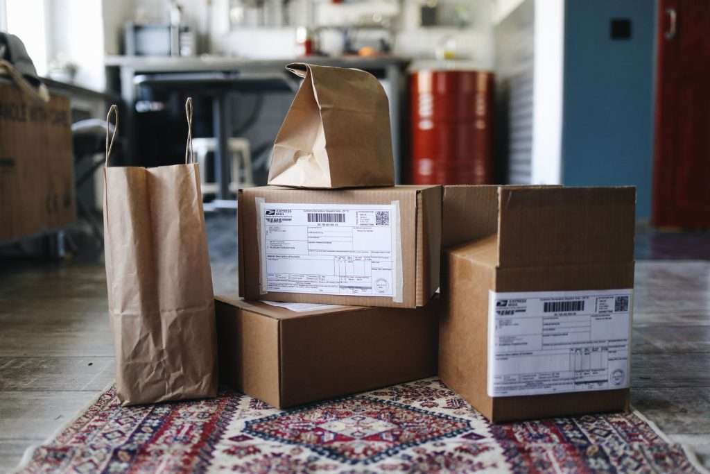 Shipping boxes and online orders representing e-commerce customer service and contact center software