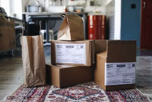Shipping boxes and online orders representing e-commerce customer service and contact center software