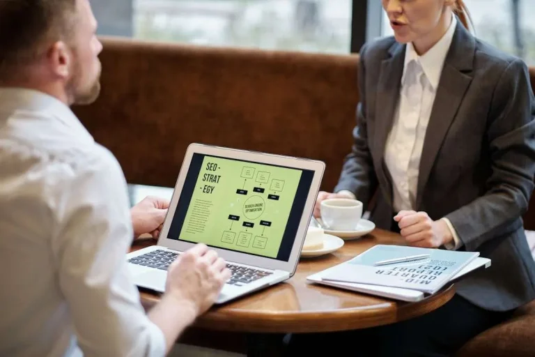 Business professionals discussing IT strategy alignment and technology planning