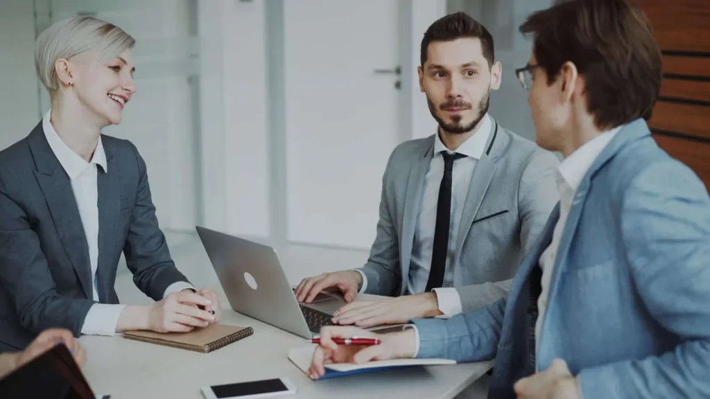 Business professionals collaborating on technology strategy in a modern Orlando office