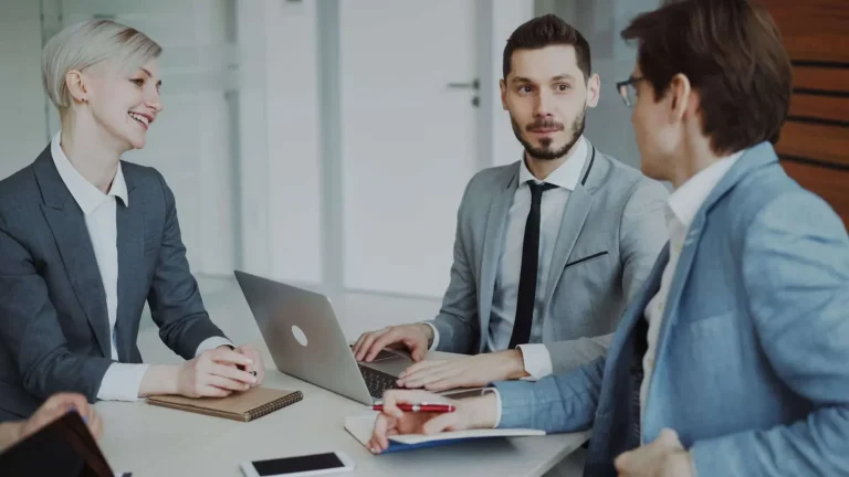 Business professionals collaborating on technology strategy in a modern Orlando office