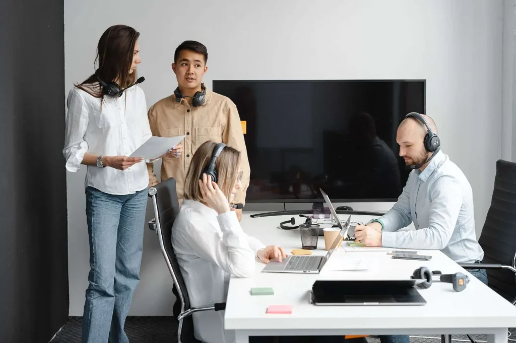 Team collaborating with a unified communications platform in a modern office
