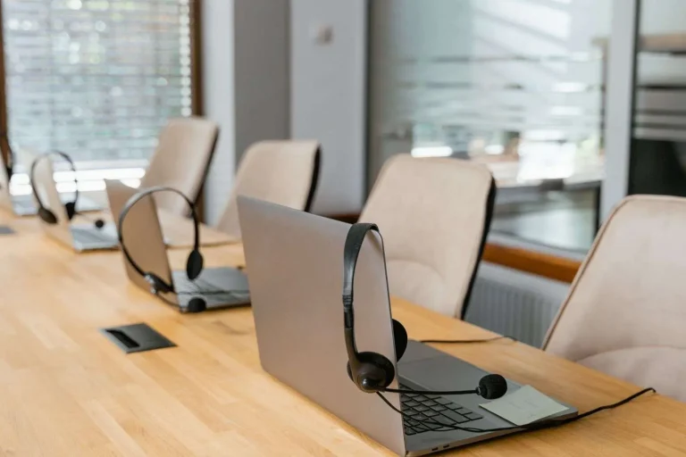 Call center agent workstations with laptops and headsets for a cloud-based SaaS call center