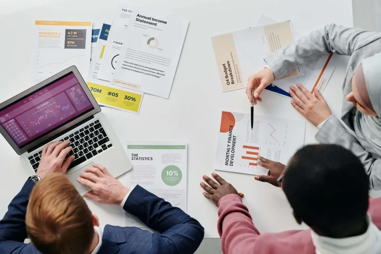 Sales team reviewing a pipeline dashboard on a laptop