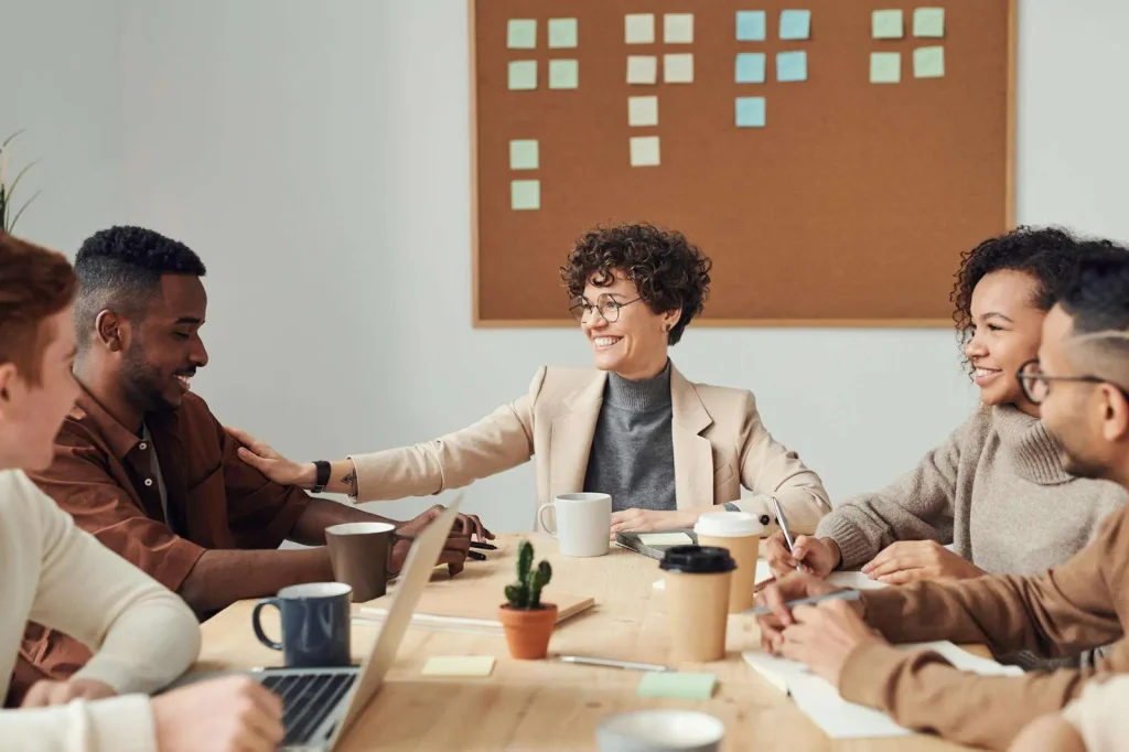 Diverse business team engaged in collaborative discussion and communication in a modern office